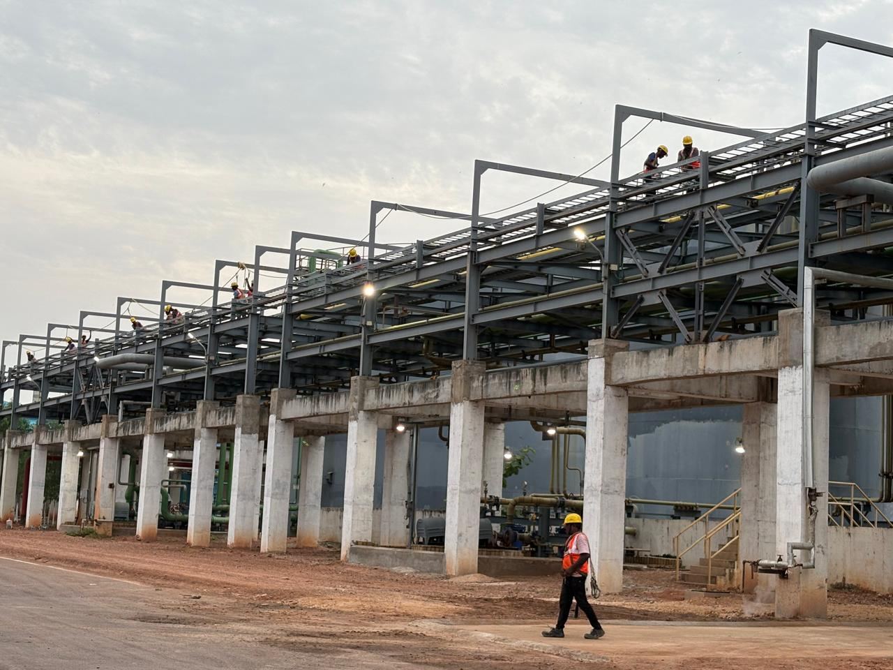 Workers on elevated structural steel platform