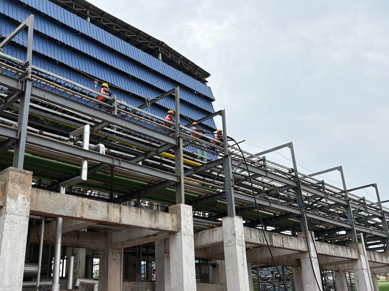 Wide view of structural steel platform with workers